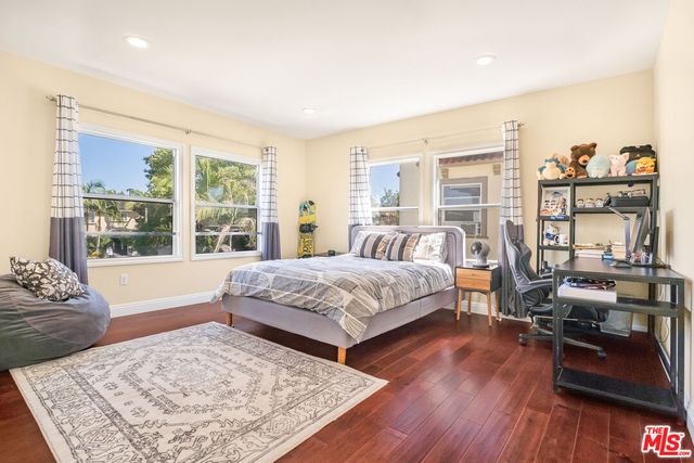 a bathroom with a sink toilet and a mirror