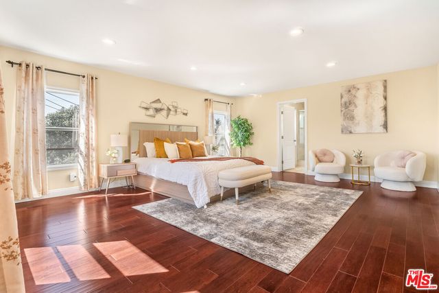 a backyard of a house with lake view and a potted plant