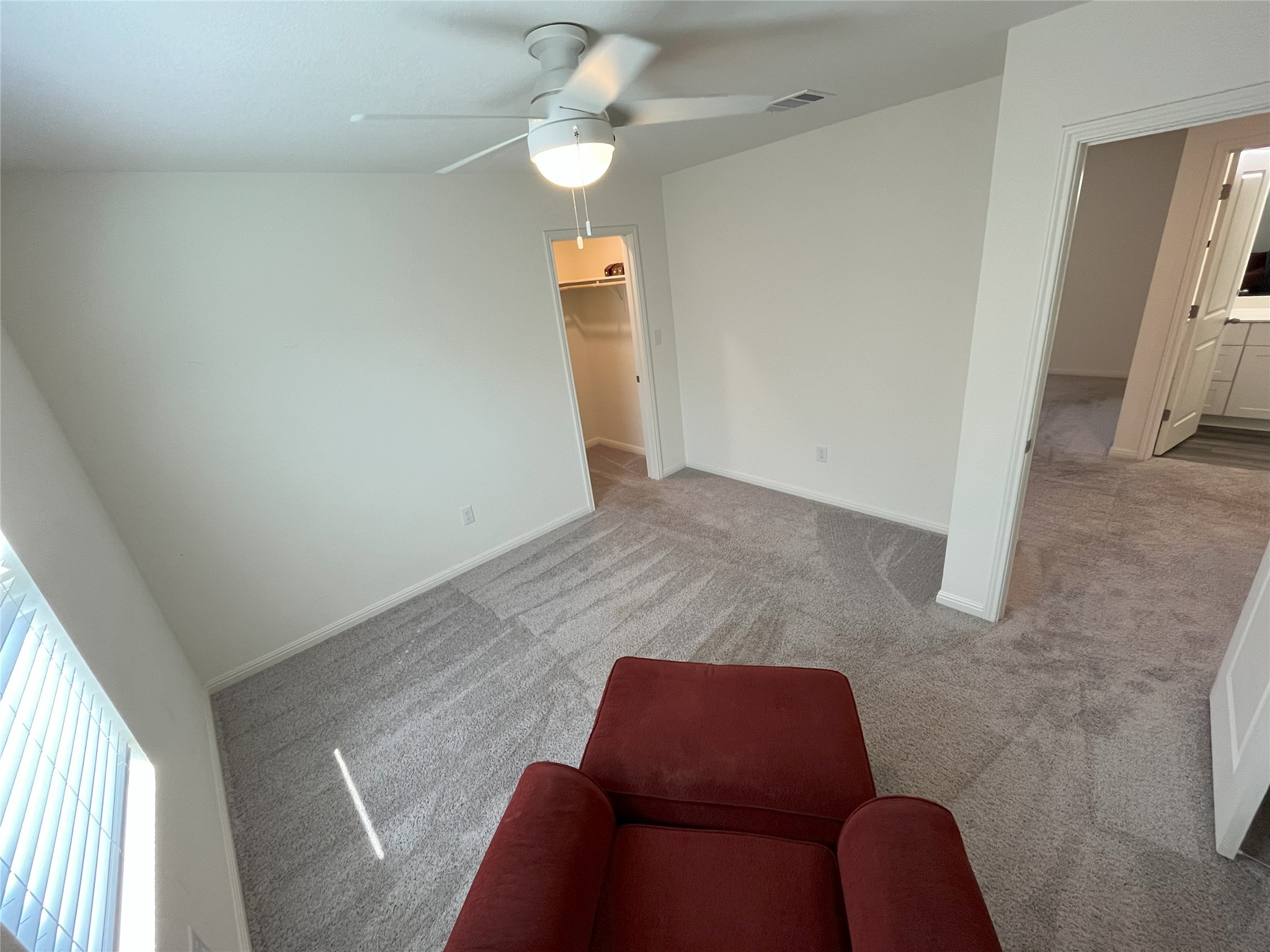 215 Light Timber Road Maxwell, TX 78656 - Photo 14 of 33 Soft carpeting underfoot anchors this quiet space featuring access to a walk-in closet.