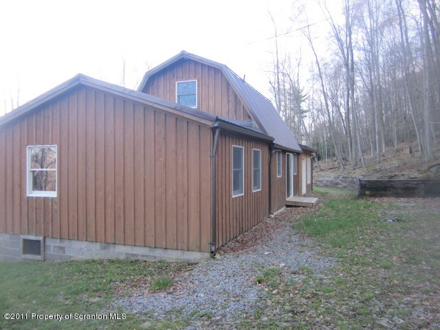 2179 Hunsinger Road Hallstead, PA 18822 - Photo 2 of 10 a view of a house with backyard and trees