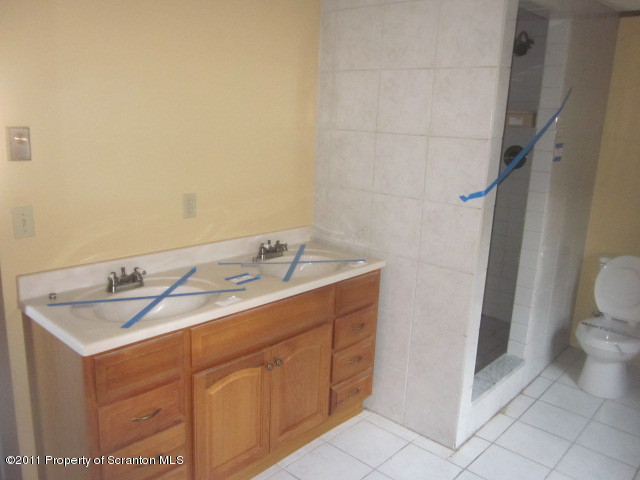 2179 Hunsinger Road Hallstead, PA 18822 - Photo 7 of 10 a bathroom with a sink and a toilet