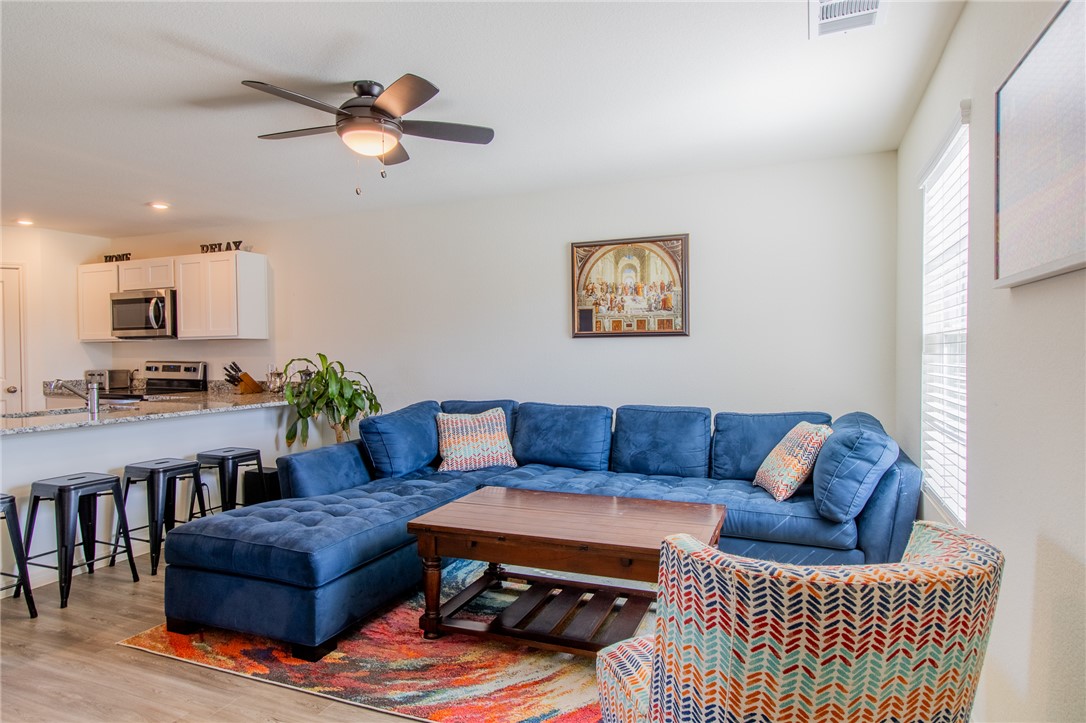 6029 Toby Bend Bryan, TX 77807 - Photo 5 of 25 a living room with furniture and kitchen view