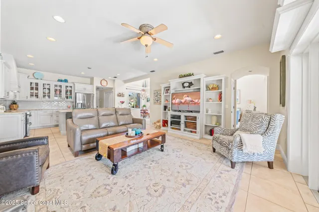 a bedroom with furniture and a chandelier