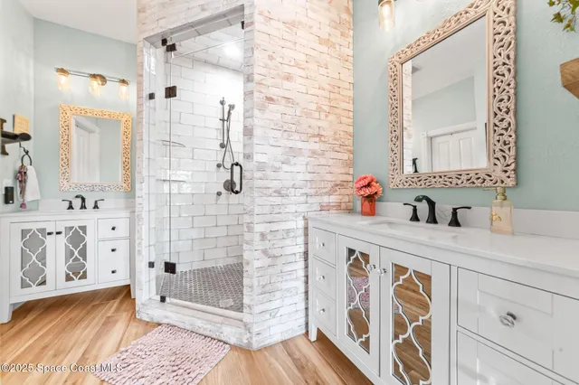 a bathroom with a sink a mirror and a shower