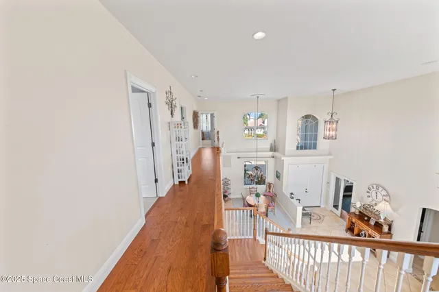 a view of a livingroom with furniture and hardwood floor
