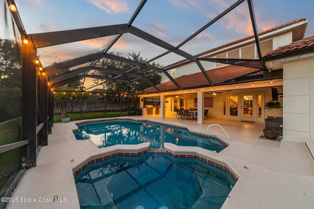 a view of swimming pool with a patio