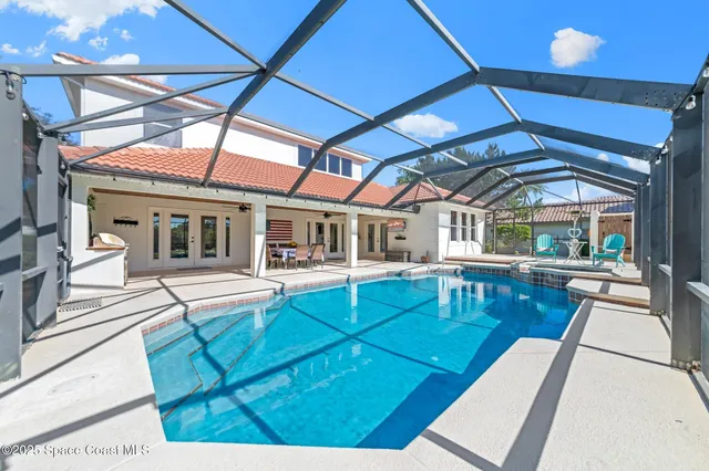 a view of a patio with table and chairs with wooden floor