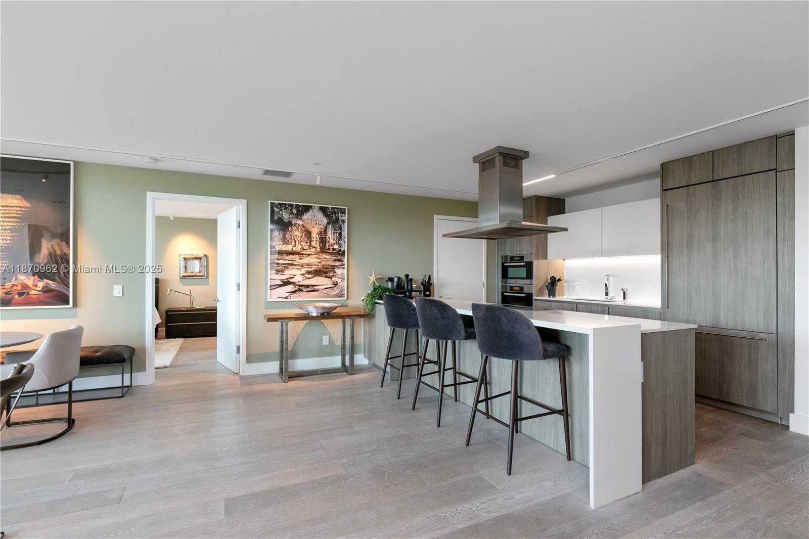 360 Ocean Drive, Unit 305S Key Biscayne, FL 33149 - Photo 12 of 27 a kitchen with stainless steel appliances granite countertop a stove and cabinets
