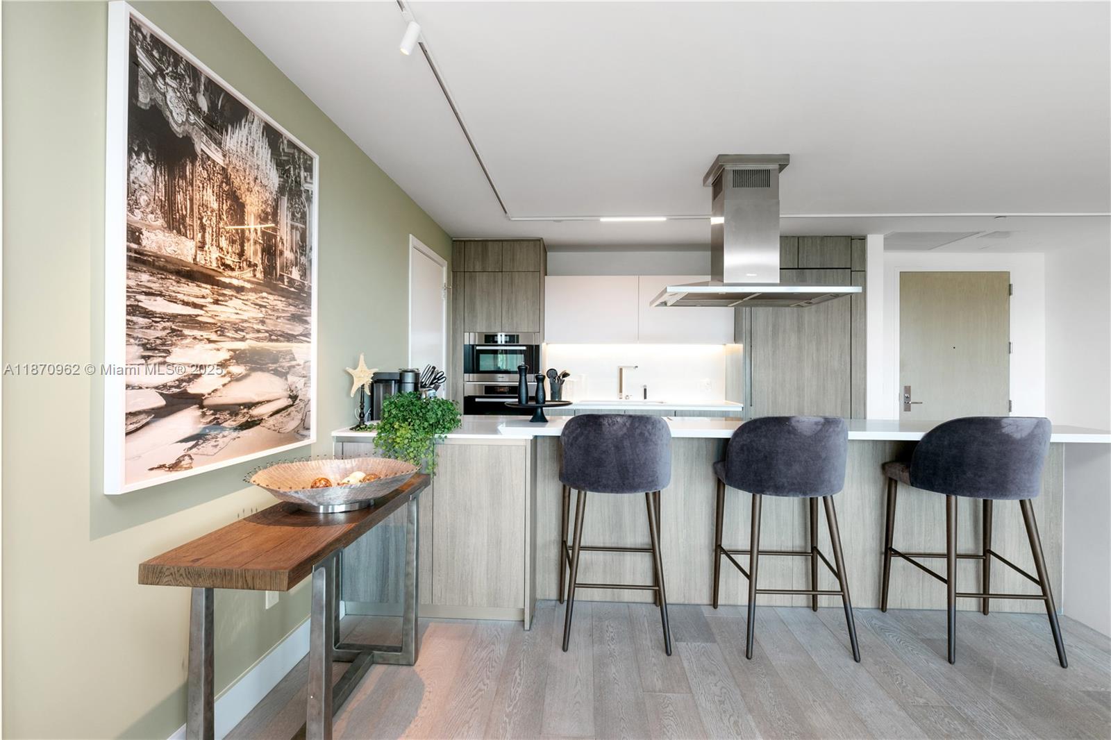360 Ocean Drive, Unit 305S Key Biscayne, FL 33149 - Photo 15 of 27 a view of a dining room with furniture and wooden floor