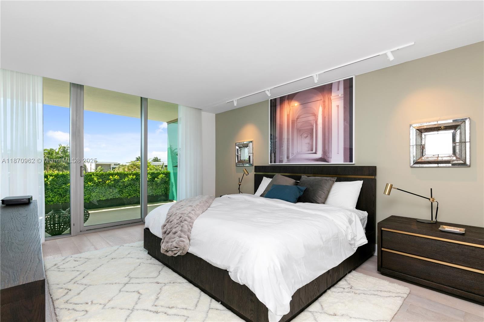 360 Ocean Drive, Unit 305S Key Biscayne, FL 33149 - Photo 17 of 27 a large bedroom with a bed and large window