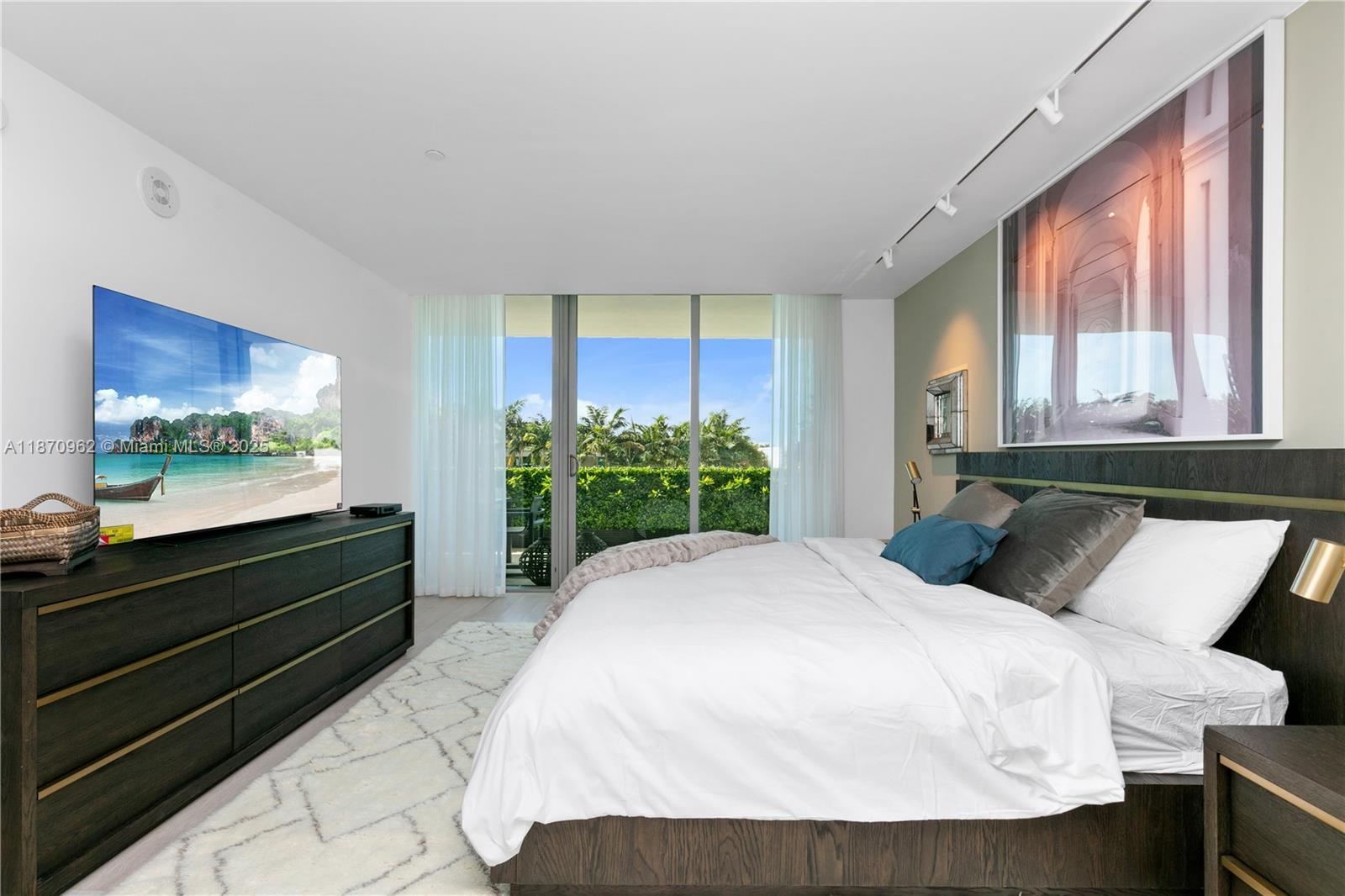 360 Ocean Drive, Unit 305S Key Biscayne, FL 33149 - Photo 18 of 27 a bedroom with a bed and a large window