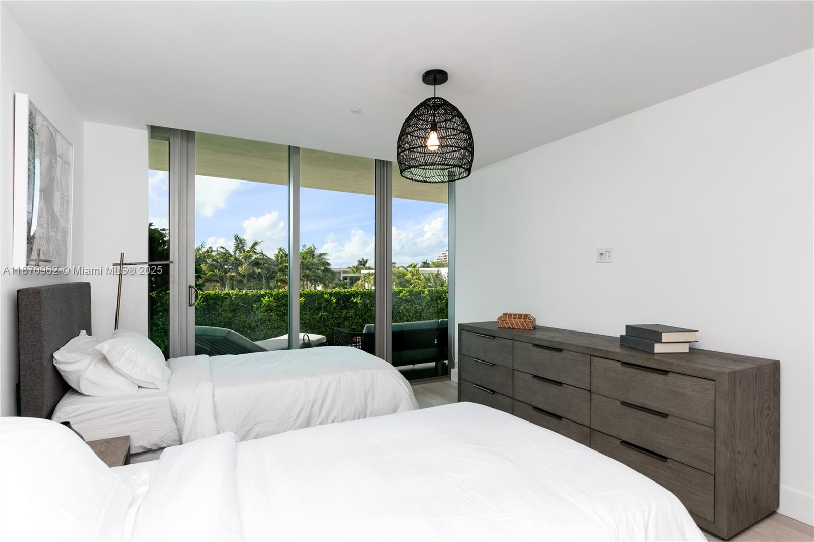 360 Ocean Drive, Unit 305S Key Biscayne, FL 33149 - Photo 21 of 27 a bedroom with a bed and a large window