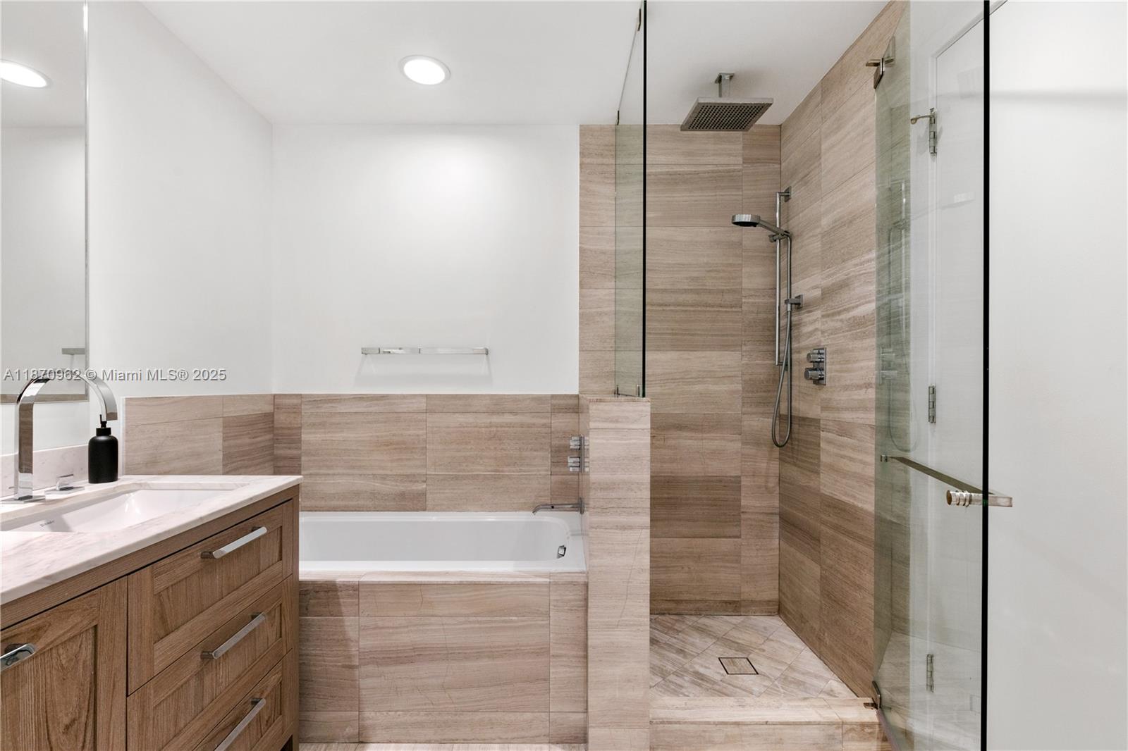 360 Ocean Drive, Unit 305S Key Biscayne, FL 33149 - Photo 23 of 27 a bathroom with a shower and a sink