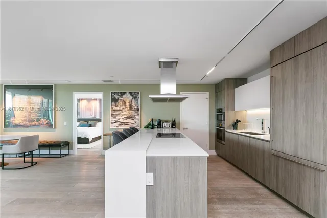 a large white kitchen with lots of counter space