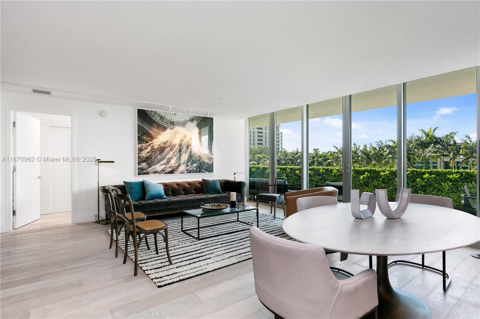 360 Ocean Drive, Unit 305S Key Biscayne, FL 33149 - Photo 9 of 27 a living room with furniture and a large window