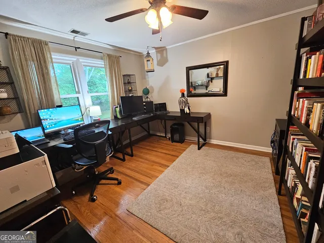 a bathroom with a toilet and a shower curtain