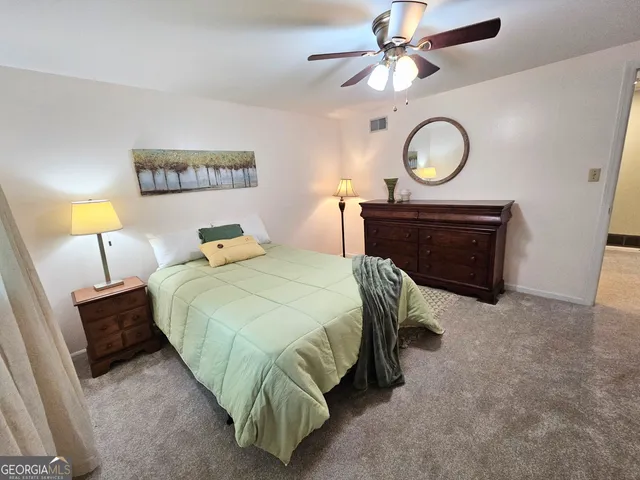 a view of a yard with a tree