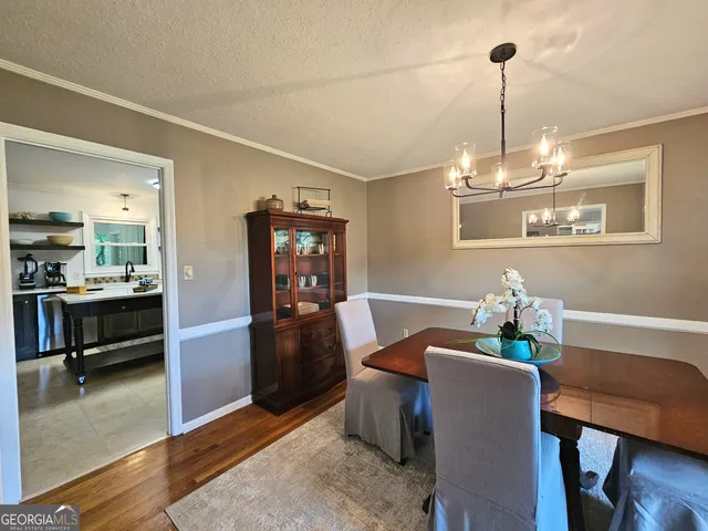 a kitchen with a sink stove and refrigerator