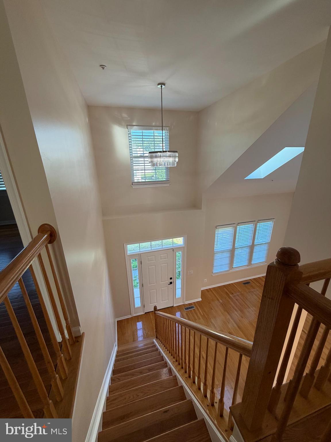 13952 Bishops Bequest Road Upper Marlboro, MD 20772 - Photo 5 of 28 a view of a hallway to a livingroom with wooden floor and stairs