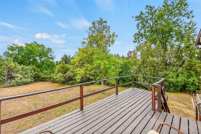 a view of balcony with lots of trees
