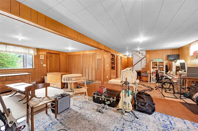 a living room with lots of furniture and a chandelier