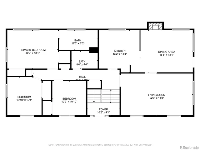 a sign that is sitting in front of flowers