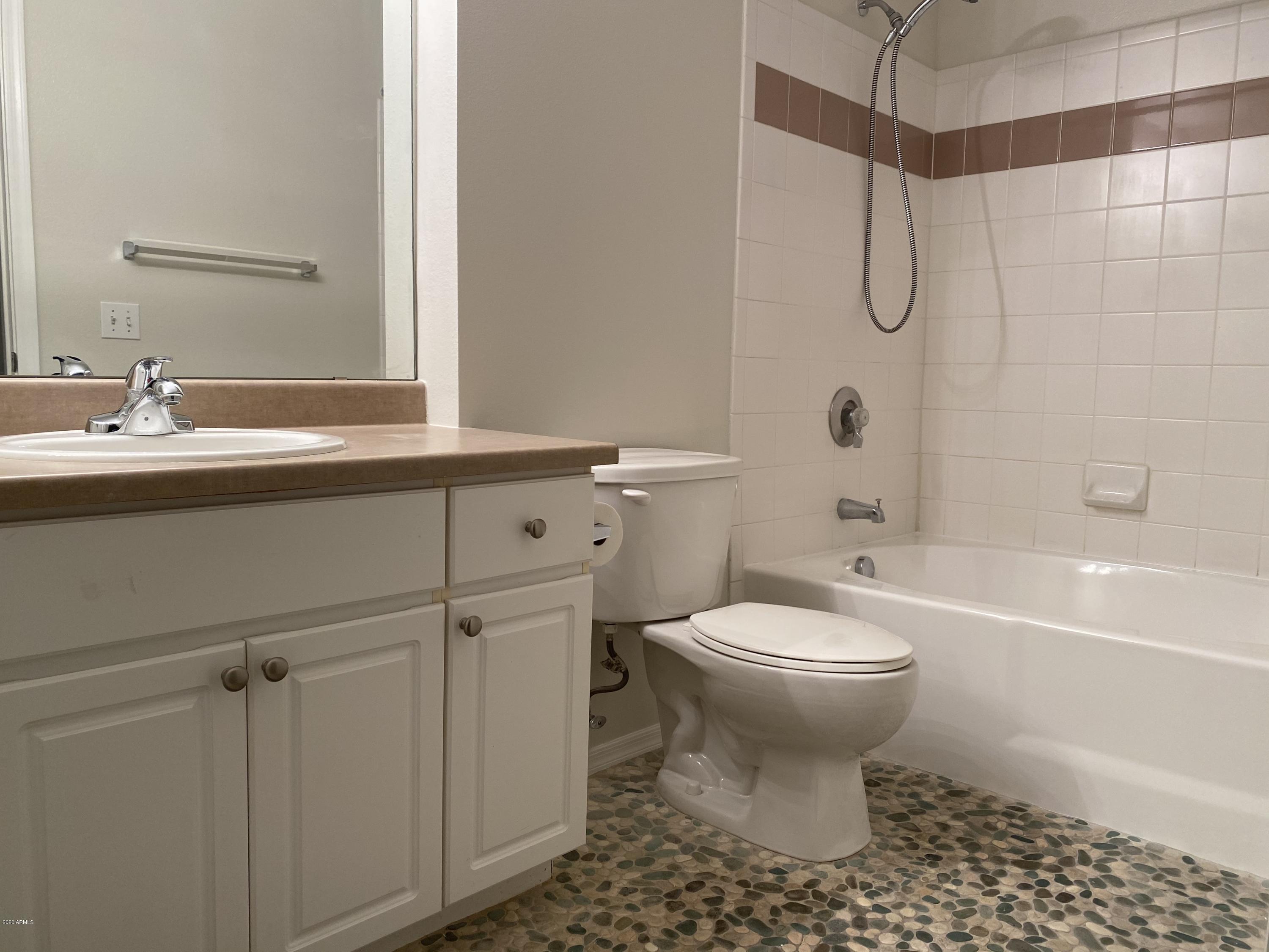 1701 East Colter Street, Unit 263 Phoenix, AZ 85016 - Photo 13 of 18 a bathroom with a sink toilet and shower