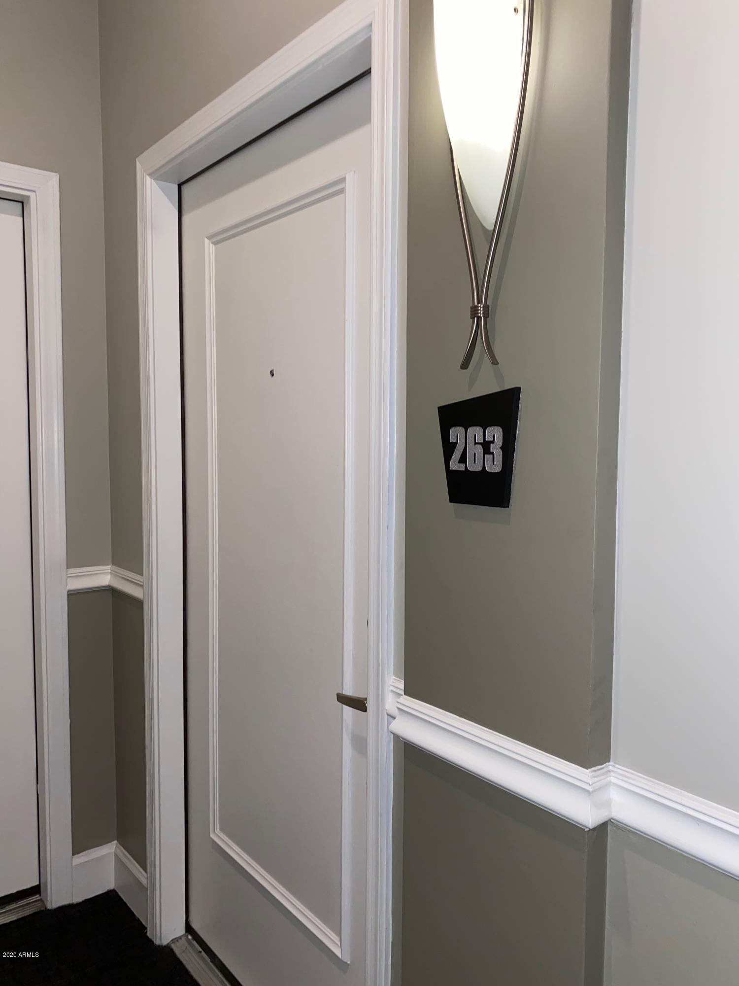 1701 East Colter Street, Unit 263 Phoenix, AZ 85016 - Photo 17 of 18 a view of a hallway with wooden floor