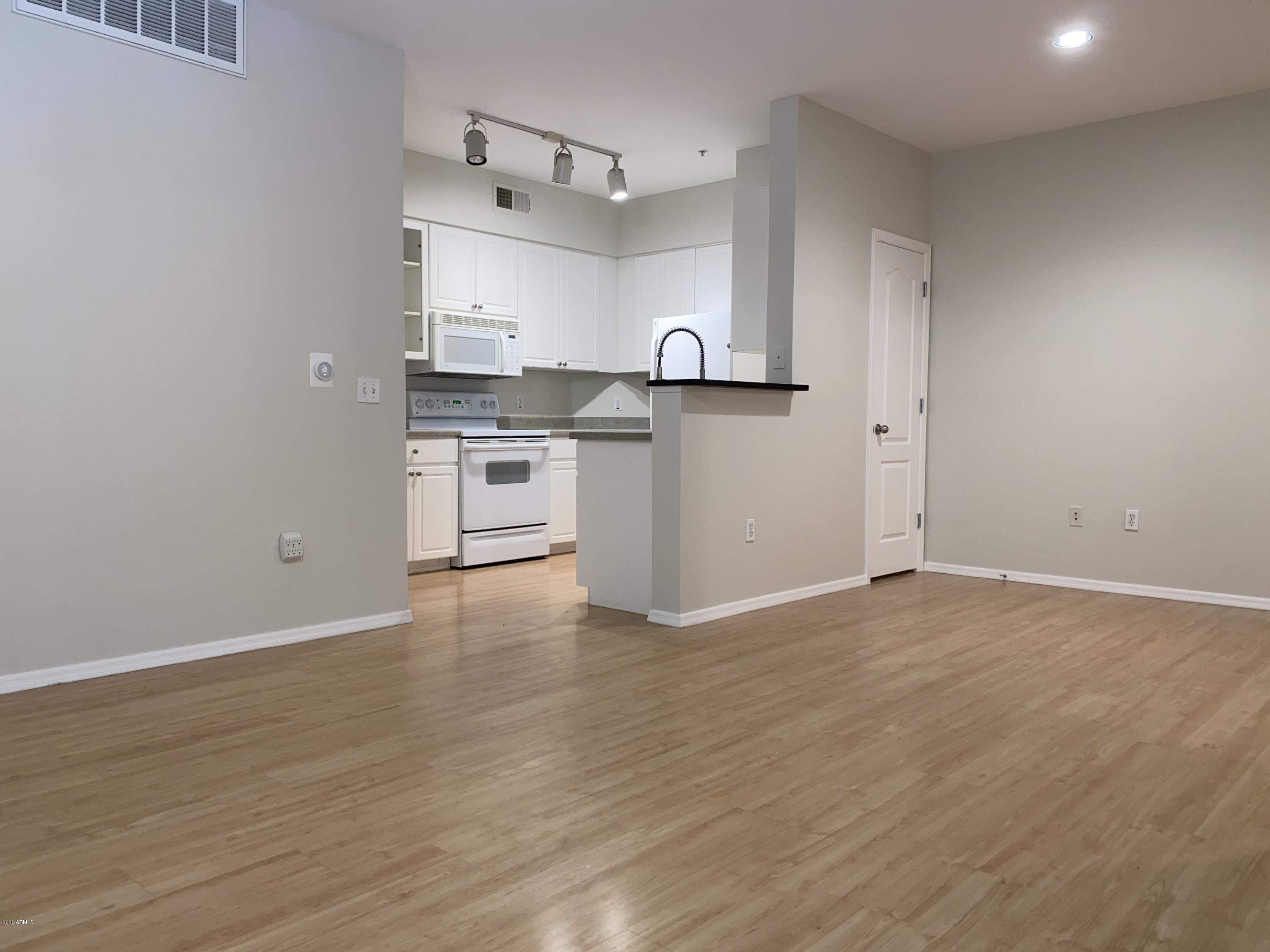 1701 East Colter Street, Unit 263 Phoenix, AZ 85016 - Photo 3 of 18 Family Room & Kitchen