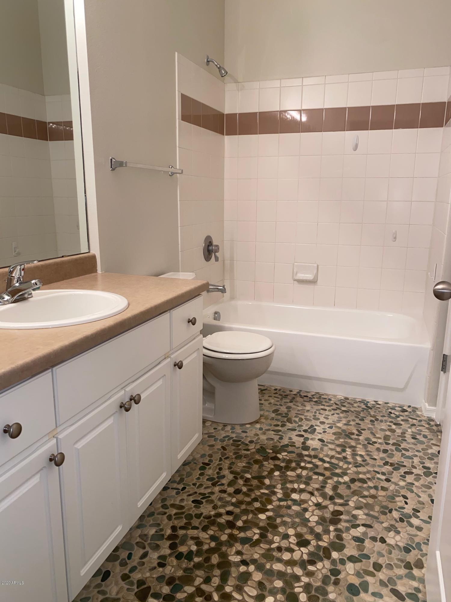 1701 East Colter Street, Unit 263 Phoenix, AZ 85016 - Photo 6 of 18 a bathroom with a sink a toilet and shower