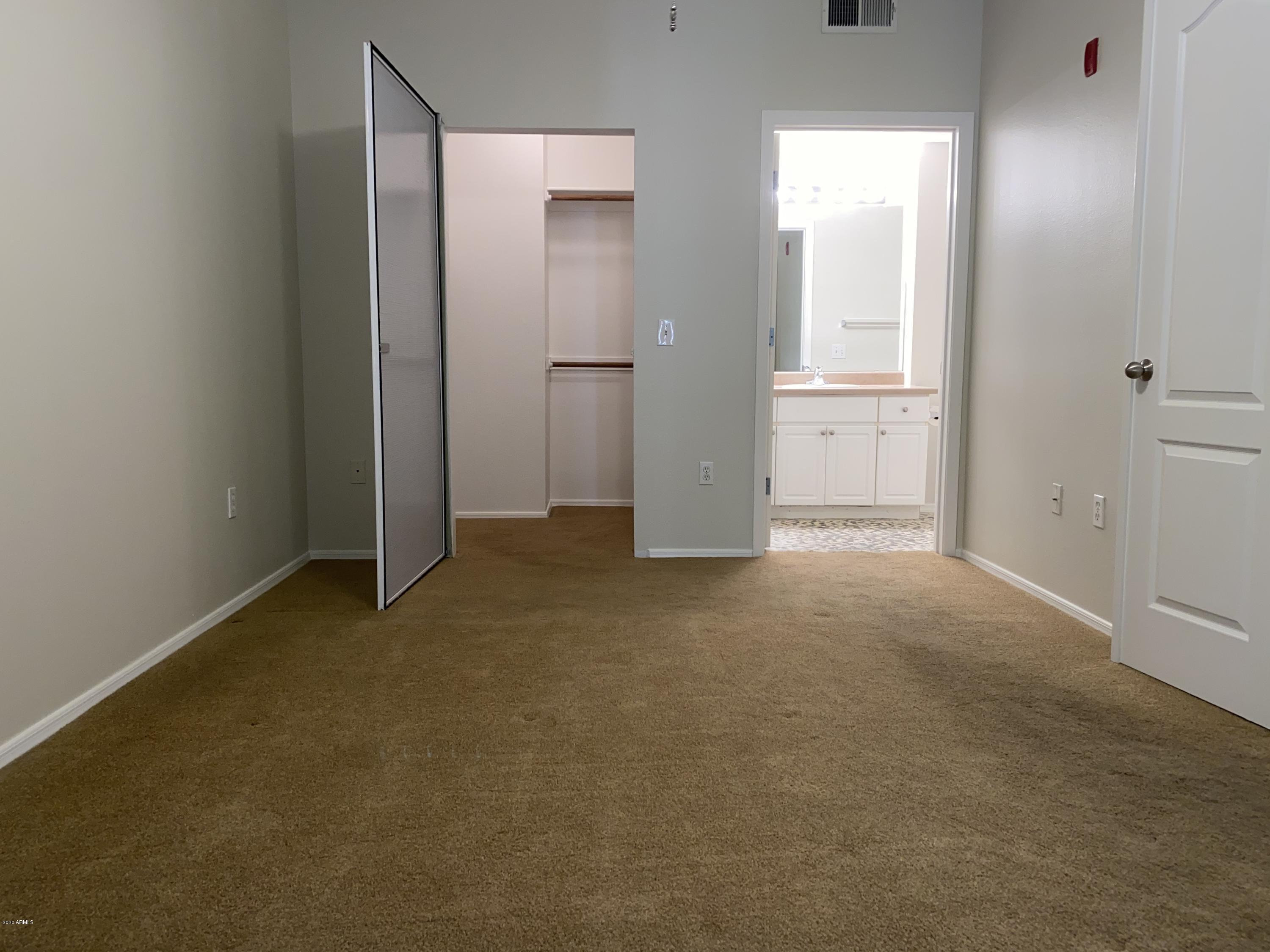 1701 East Colter Street, Unit 263 Phoenix, AZ 85016 - Photo 10 of 18 an empty room with an entryway