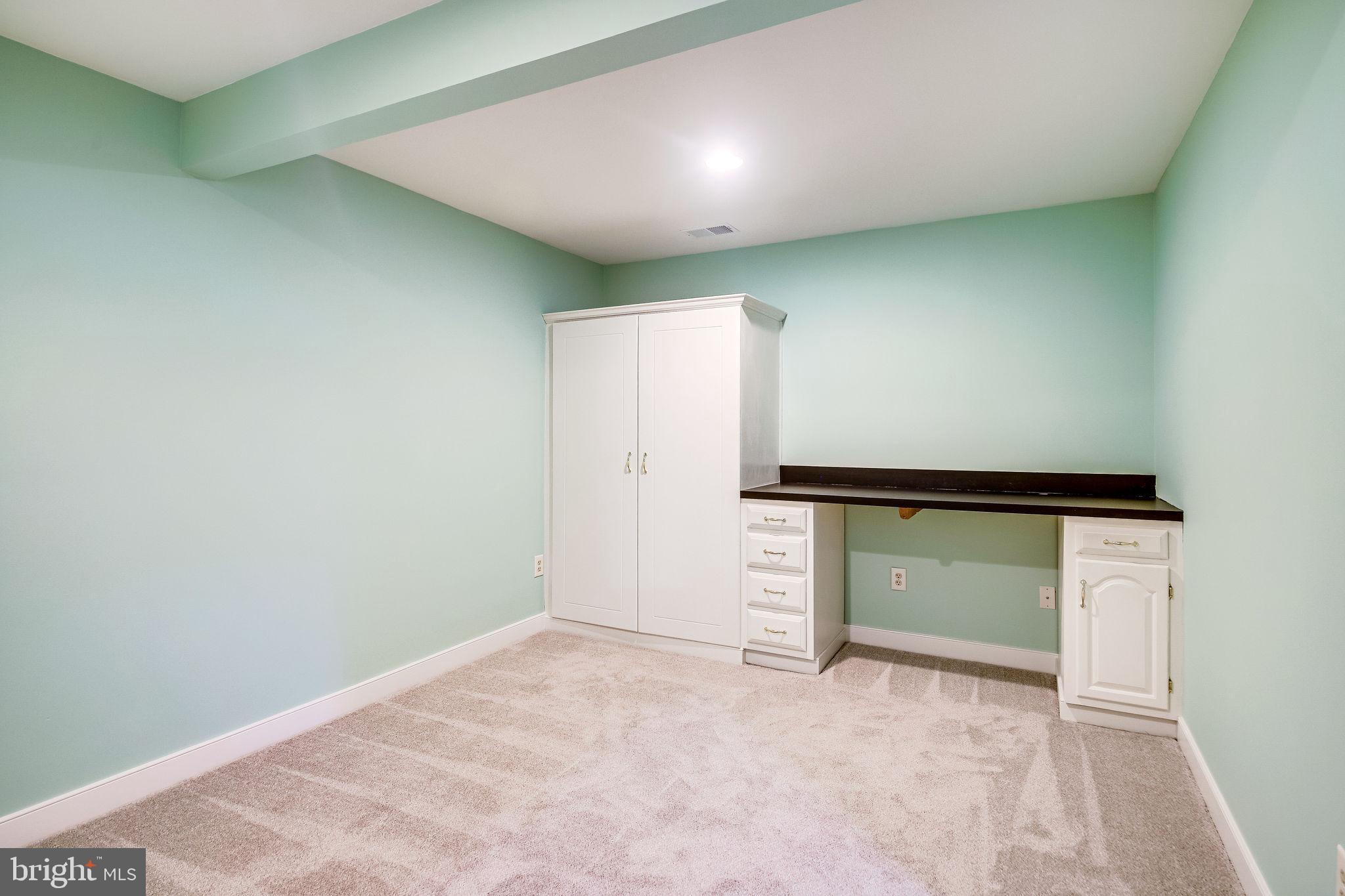 58 Rutherford Circle Sterling, VA 20165 - Photo 44 of 51 Den has built-in desk and cabinet