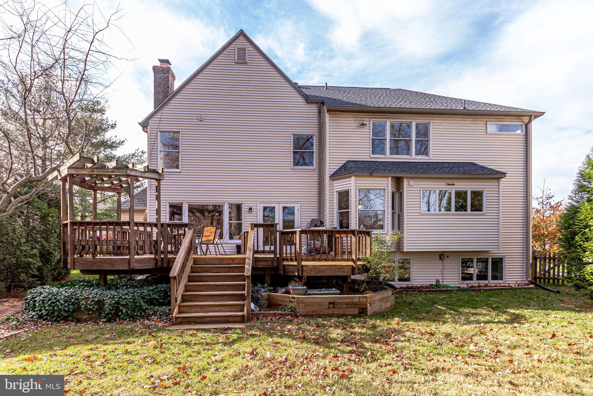 58 Rutherford Circle Sterling, VA 20165 - Photo 47 of 51 Steps down from the deck to fenced yard