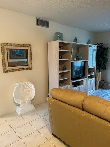 a bedroom with a bed and dresser