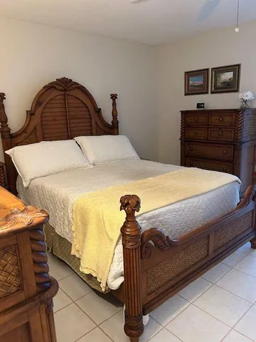 a bedroom with a bed and a dresser