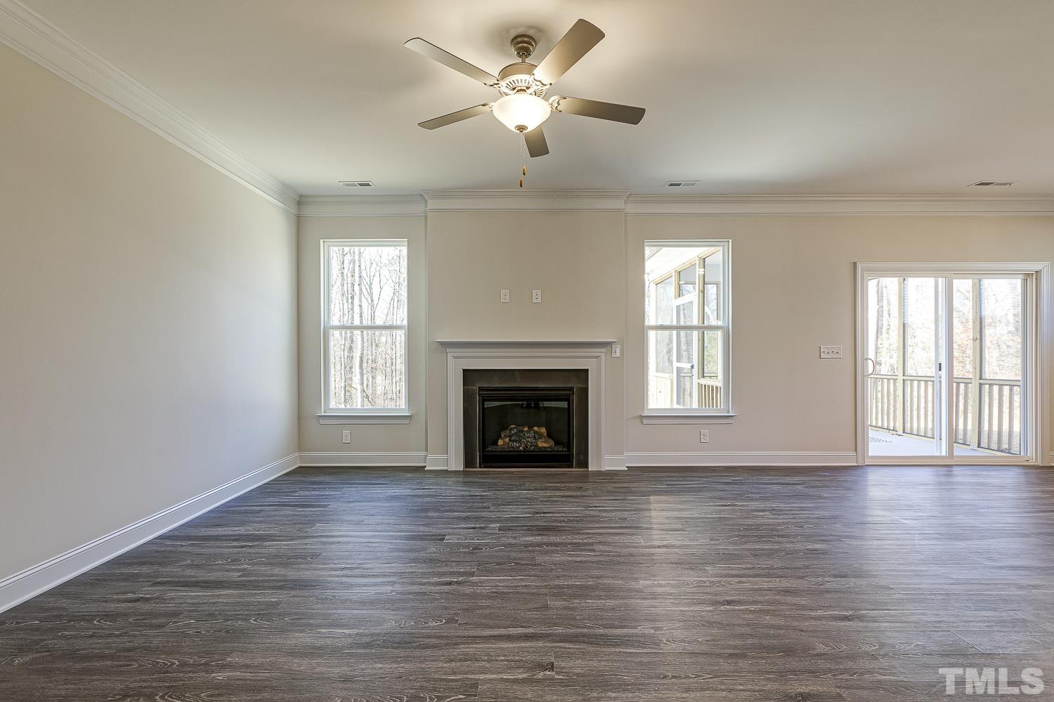 435 Cliffview Drive Garner, NC 27529 - Photo 16 of 45 wooden floor fireplace and windows in an empty room