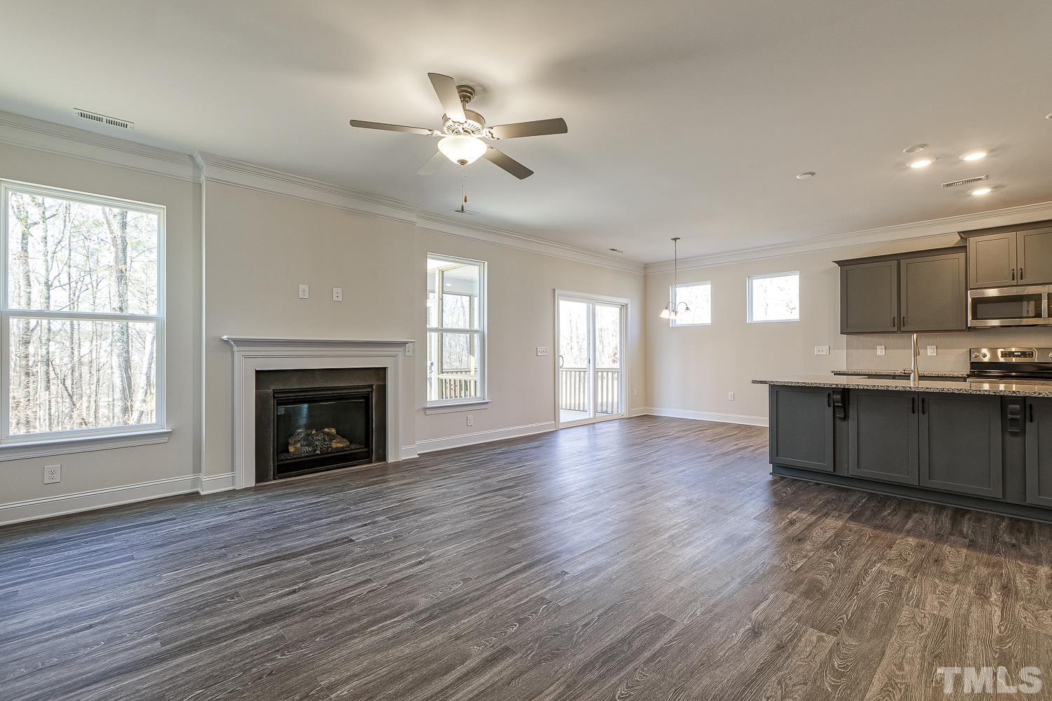 435 Cliffview Drive Garner, NC 27529 - Photo 18 of 45 a large kitchen with hardwood floor a sink stainless steel appliances and window