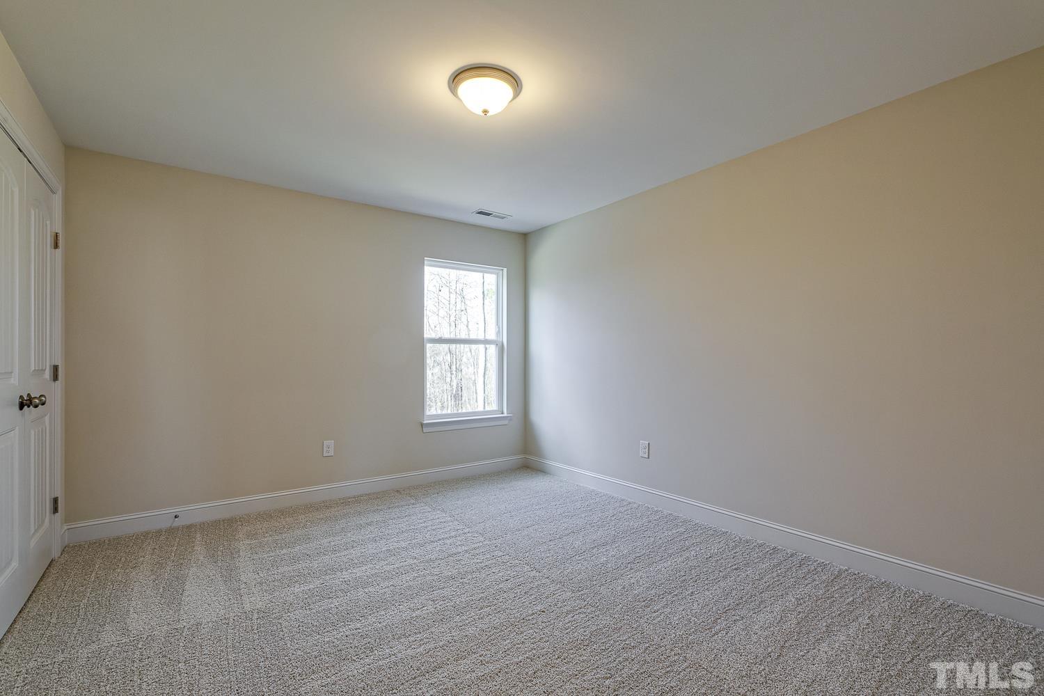 435 Cliffview Drive Garner, NC 27529 - Photo 30 of 45 a view of room with window and hardwood floor