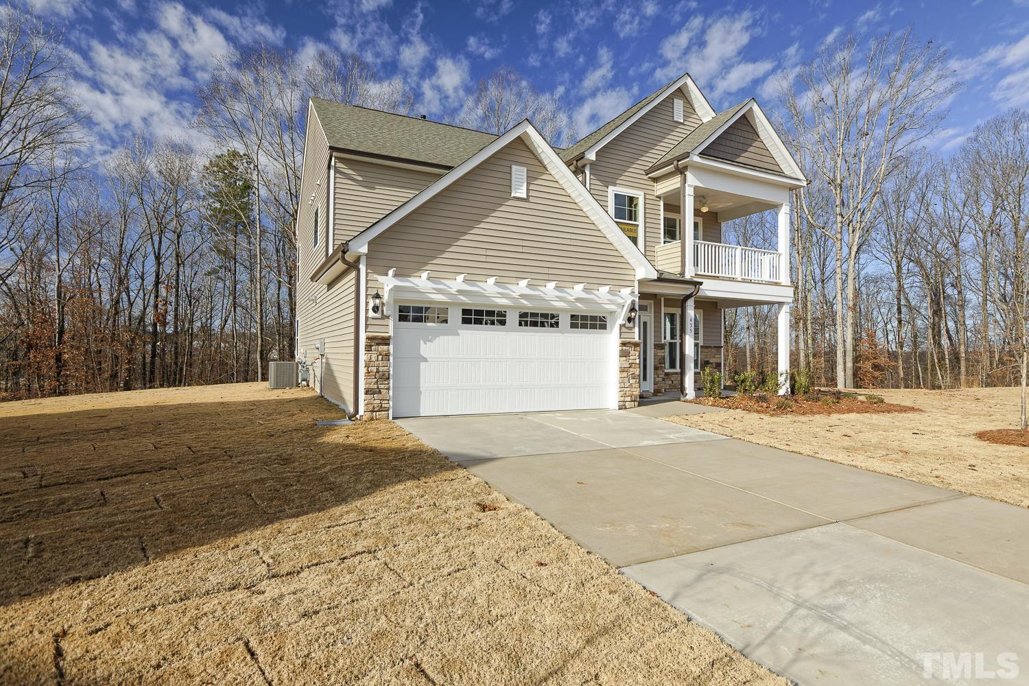 435 Cliffview Drive Garner, NC 27529 - Photo 3 of 45 a front view of a house with a yard and garage