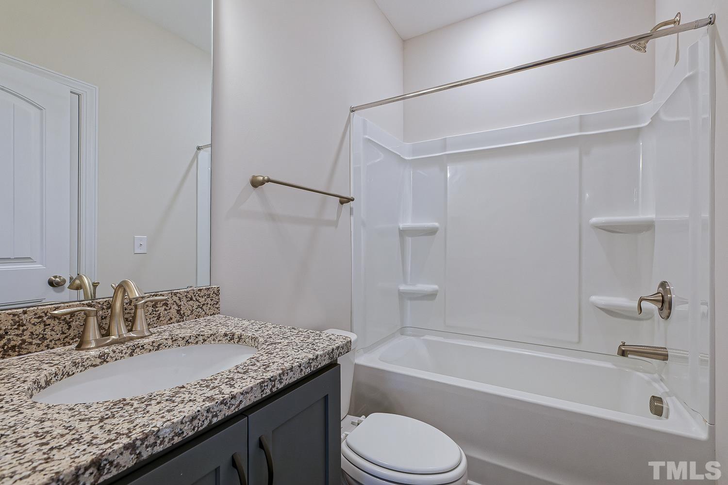 435 Cliffview Drive Garner, NC 27529 - Photo 41 of 45 a bathroom with a granite countertop sink toilet and shower