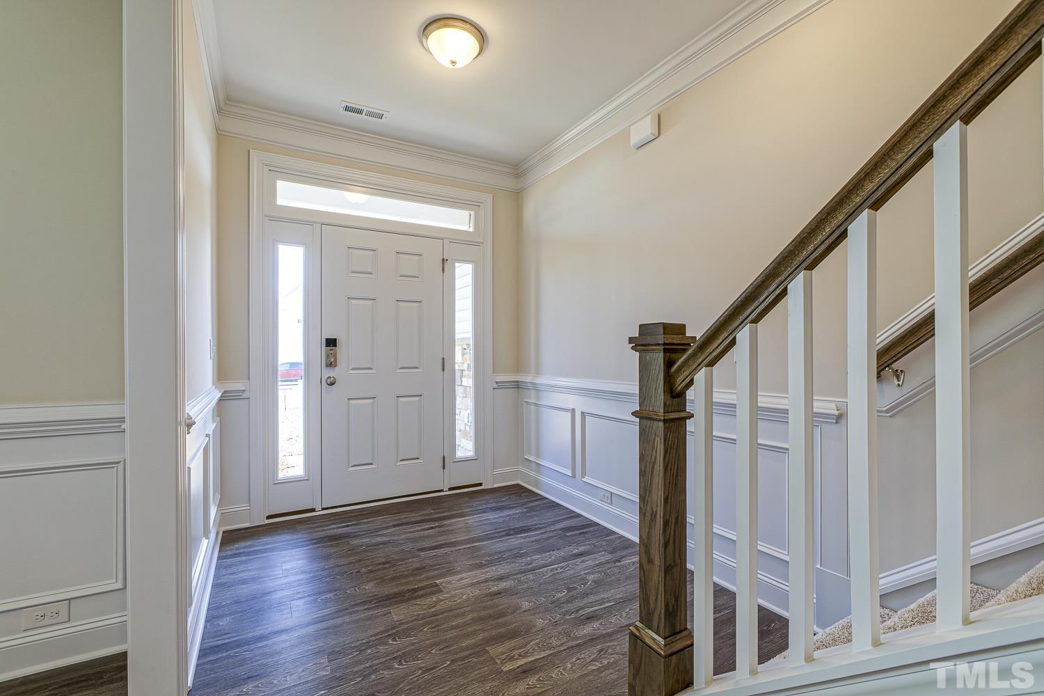 435 Cliffview Drive Garner, NC 27529 - Photo 7 of 45 a view of entryway with wooden floor and stair