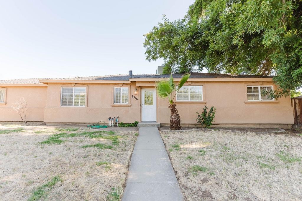 4916 Summit Way Modesto, CA 95357 - Photo 1 of 1 a house with trees in the background