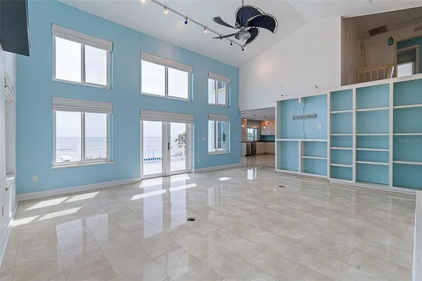 a view of a balcony with chair and wooden floor