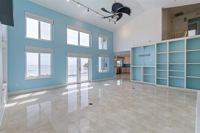 a view of a balcony with chair and wooden floor