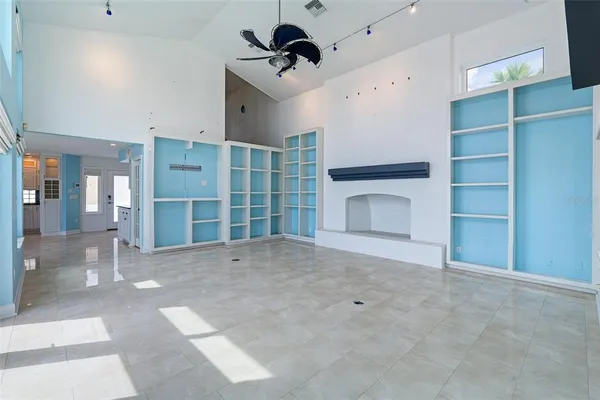 a view of a balcony with floor to ceiling window and city view