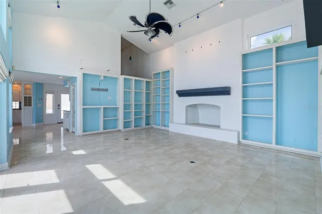 a view of a balcony with floor to ceiling window and city view