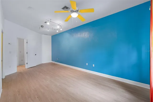 an aerial view of a house with a big yard and potted plants