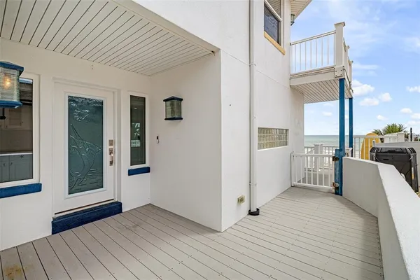 a kitchen with kitchen island granite countertop white cabinets and stainless steel appliances
