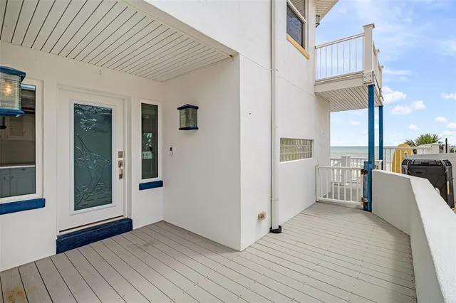 a kitchen with kitchen island granite countertop white cabinets and stainless steel appliances
