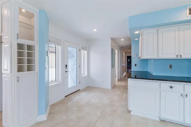 a large kitchen with a large window
